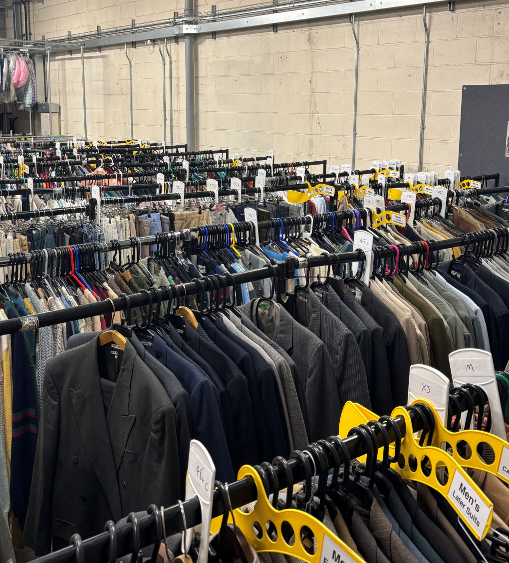 The frame is filled with rail upon rail of clothes... all labelled by gender, size and the period they are from.
