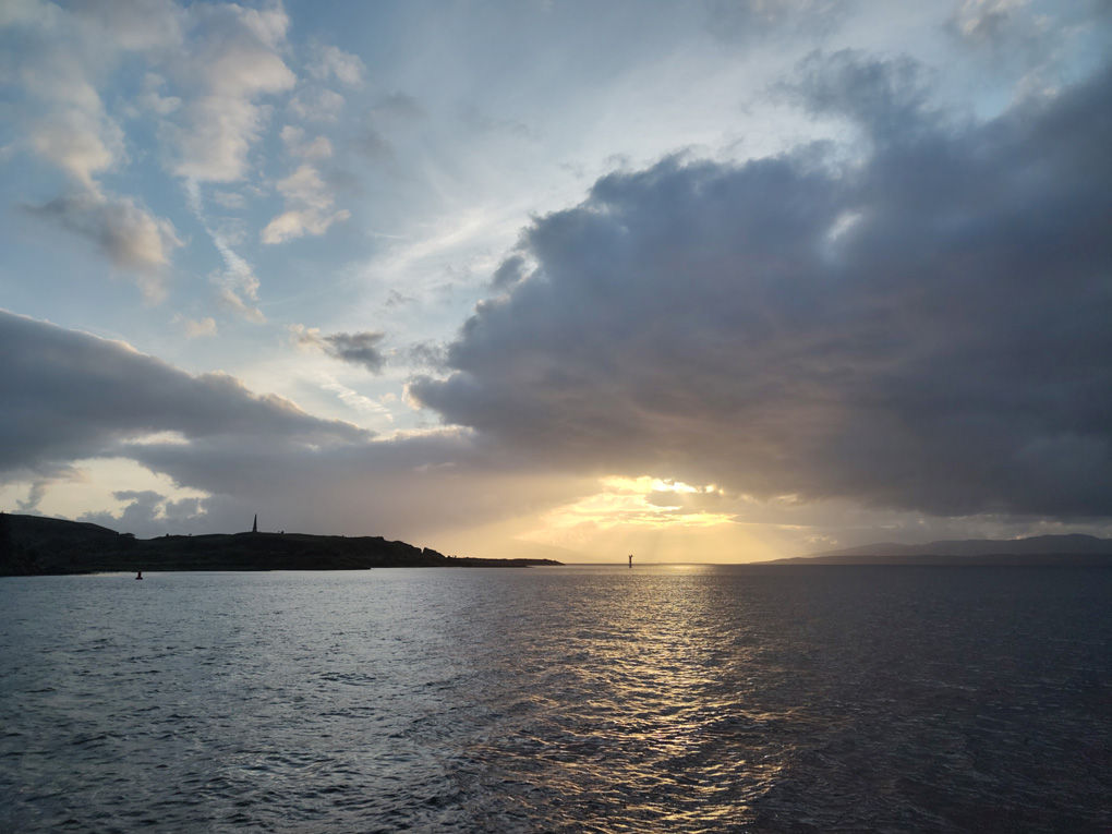 Sun setting over the mouth of a river