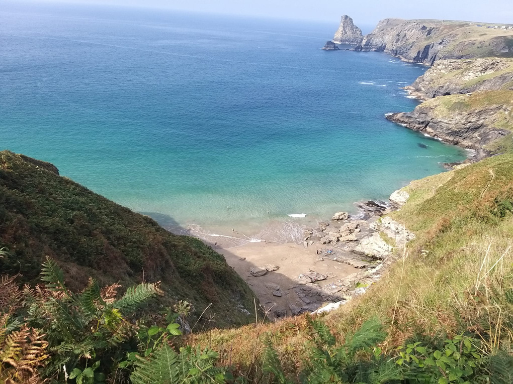 View down the cliffs to the beach from the South West coast path