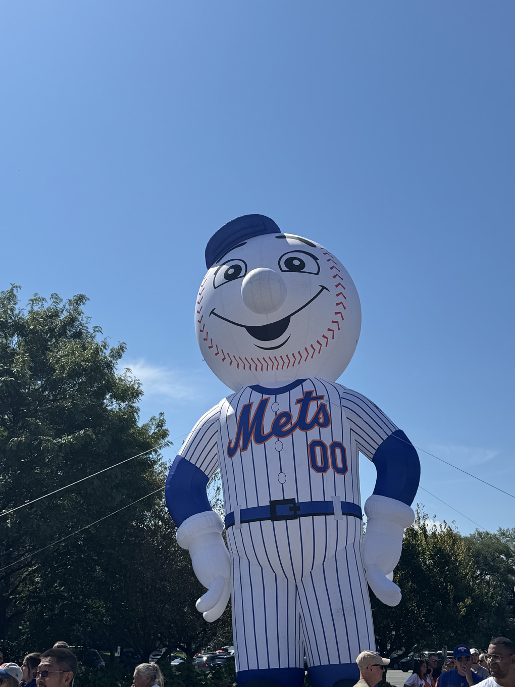 Large inflatable mets mascot with sunny blue sky