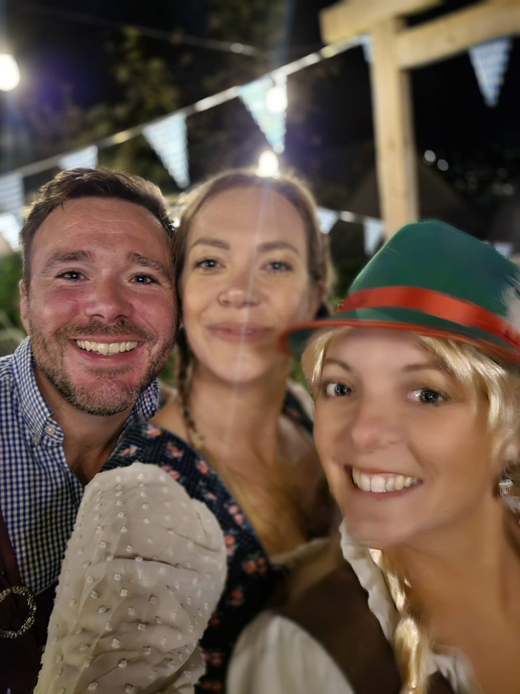 Two women and a man dressed in traditional German clothing
