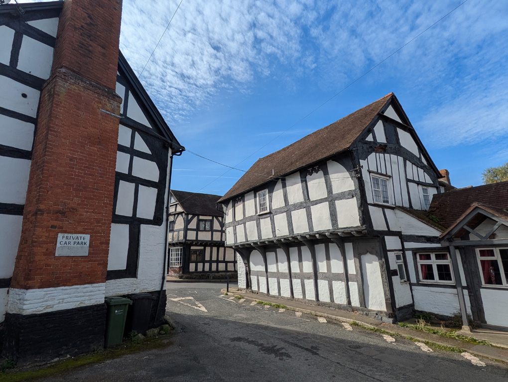 Tudor houses under a blue sky