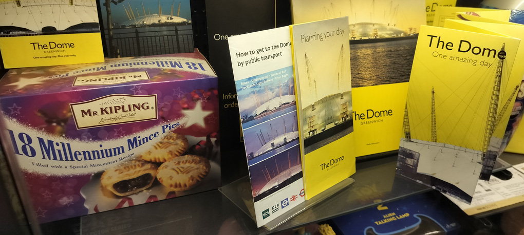 A collection of items centred around the Millennium Dome. Programmes, leaflets, transport information and, weirdly, a promotional pack of Mr Kipling's 18 Millennium Mince Pies.