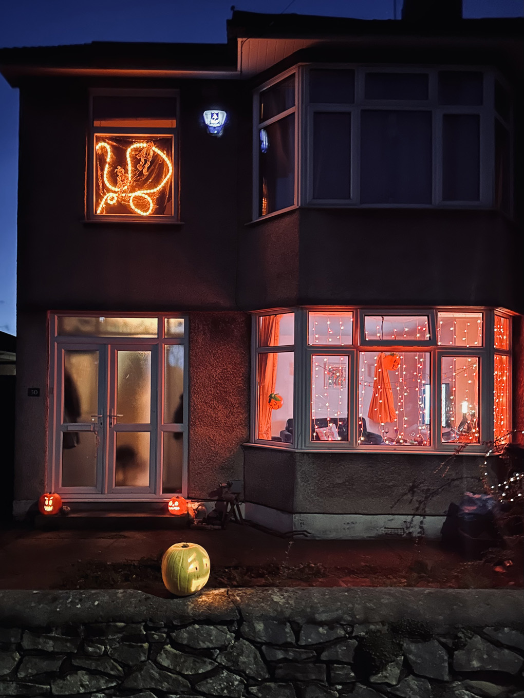 House with Halloween decorations up.