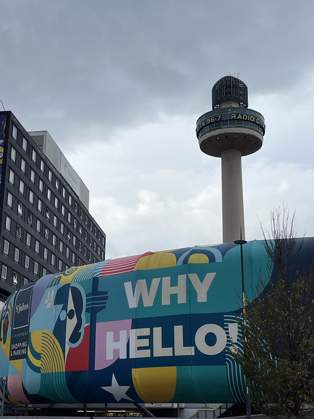 A colourful sign saying Well Hello