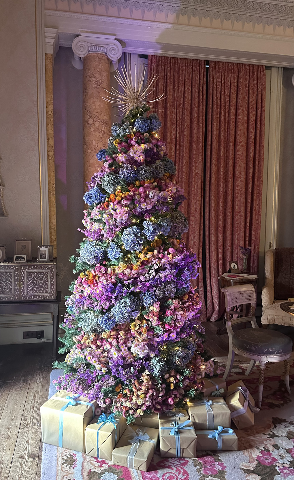 Dried flower Christmas tree set in a National Trust room