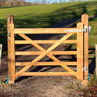 Photo of a gate in the middle of a path with no fencing either side so it's pretty pointless.