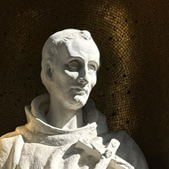Statue of st Francis of Assisi in the sun