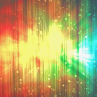 Rainbow patterned desktop background lined up over 3 pc monitors.