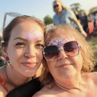 Picture of two smiling ladies at a festival