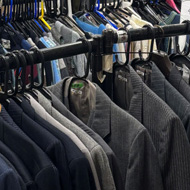 The frame is filled with rail upon rail of clothes... all labelled by gender, size and the period they are from.