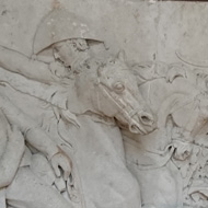 Part of a frieze which was originally on the base of the Picton Monument created in 1827. The frieze looked like it was sculpted out of sandstone with cement and depicts the attack by General Picton on Badajoz and his death falling off his horse into the arms of a soldier of the Highlands Division during the battle of Waterloo in 1815. The Monument was designed by John Nash and made by E.H. Baily in 1827. It stood 23m tall and was replaced by the present obelisk in 1846 as it was then unsafe and unfashionable. It must have been very impressive as the carving was very well done.