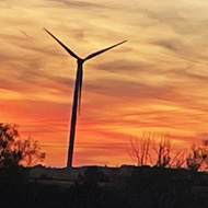 A lovely sunset with a wonderful wind turbine in the foreground.