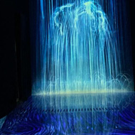 Blue lights representing a waterfall in the dark