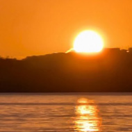 sunset over still water