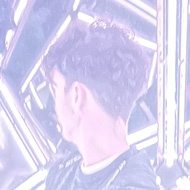 Teenage boy in an infinitely reflecting mirror installation