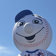 Large inflatable mets mascot with sunny blue sky