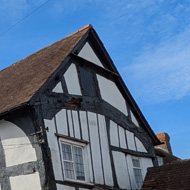 Tudor houses under a blue sky