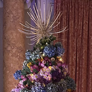 Dried flower Christmas tree set in a National Trust room