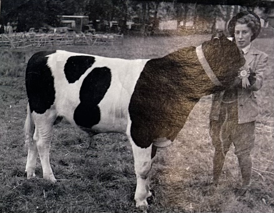 My aunt at a show with her prize winning cow