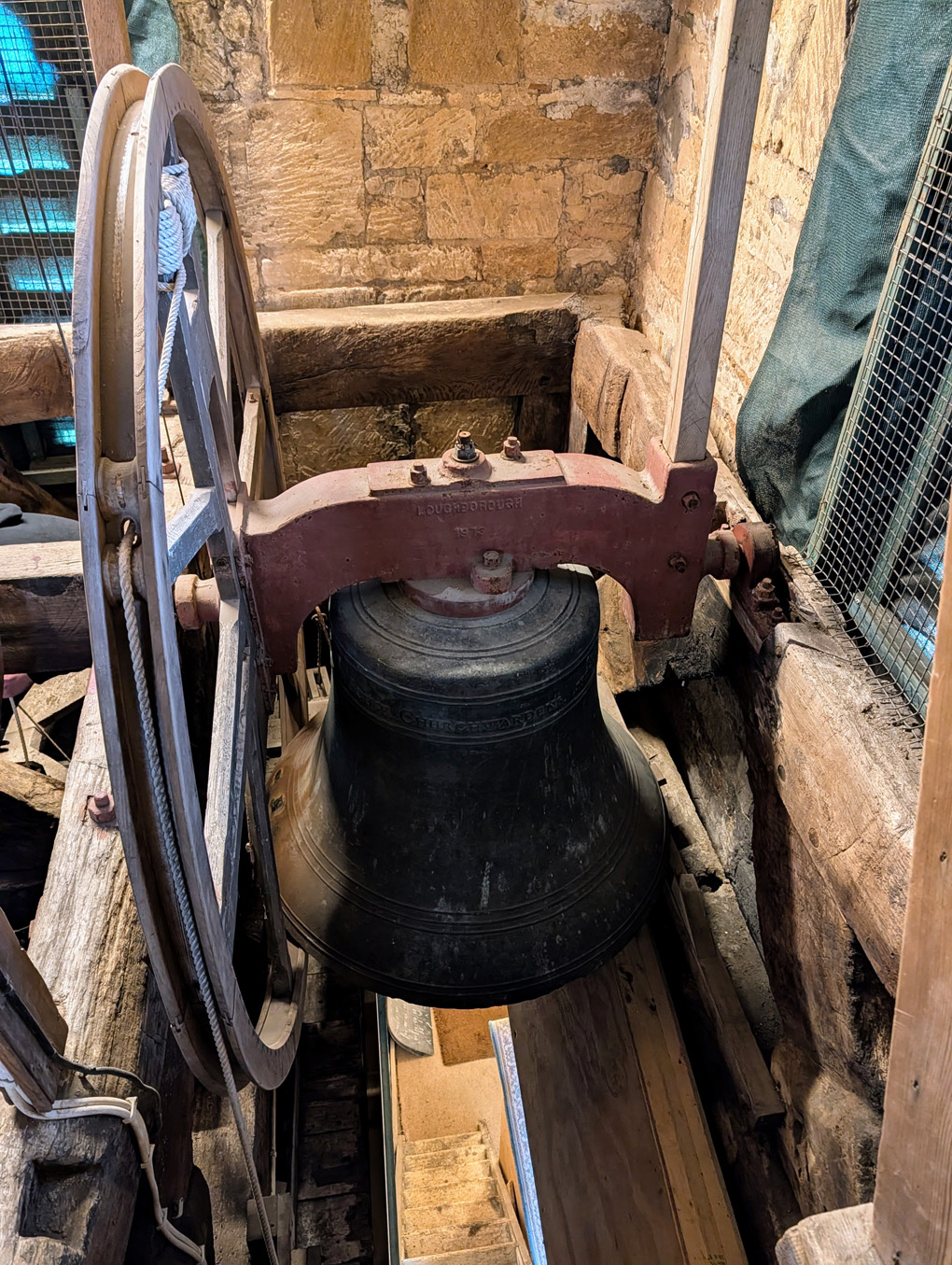 Picture of a bell in a church tower.
