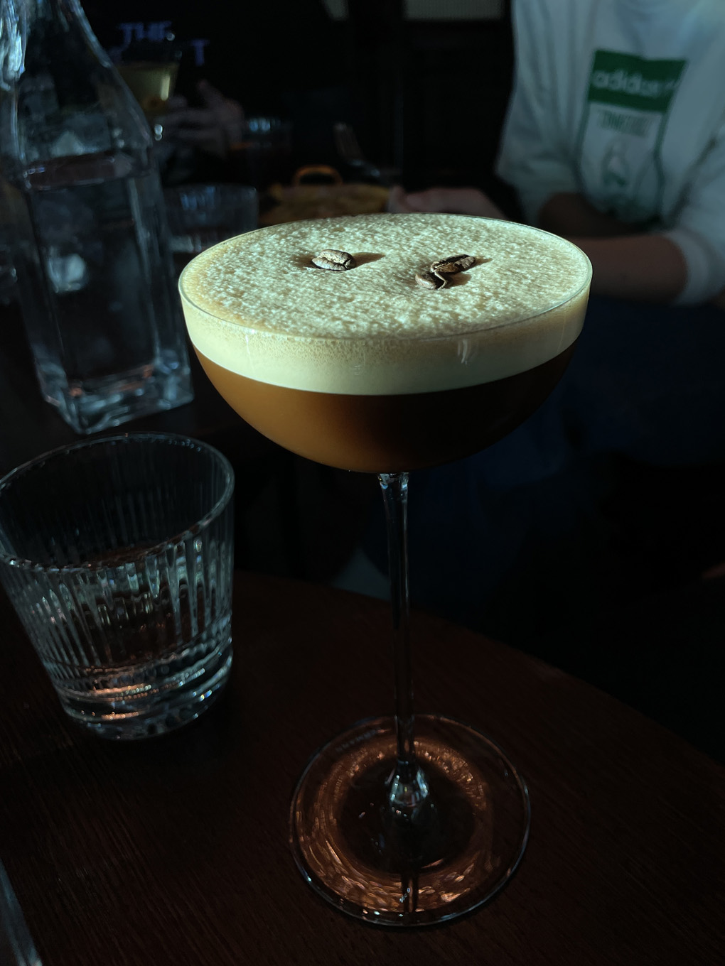 Espresso martini lit up by sunlight.