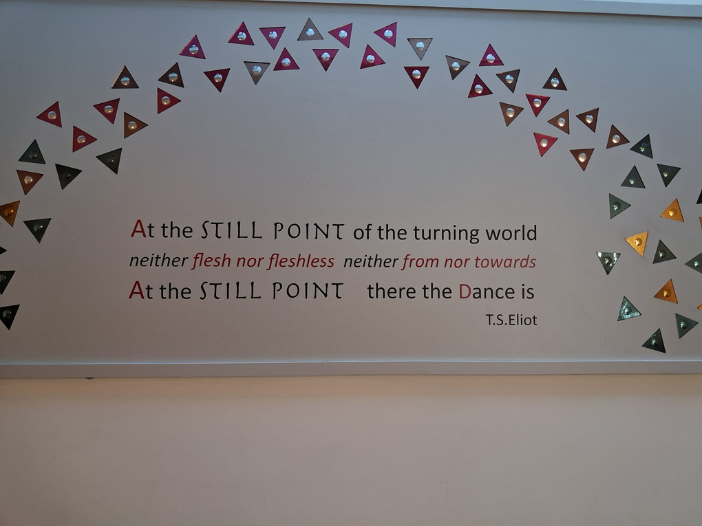Framed T.S. Elliot quote that reads 
