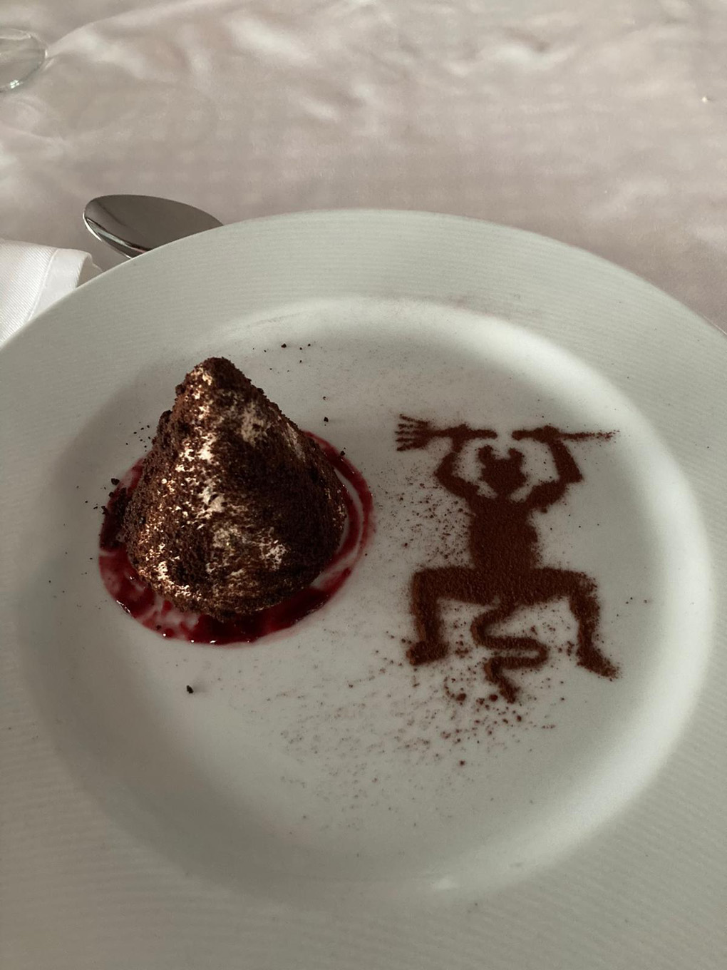Dessert with a devil in cocoa powder