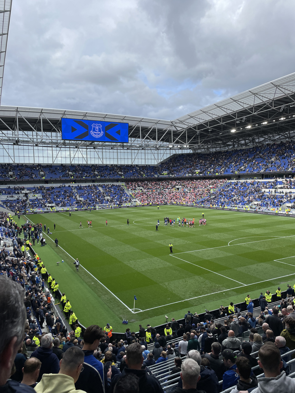 Football pitch inside a stadium.