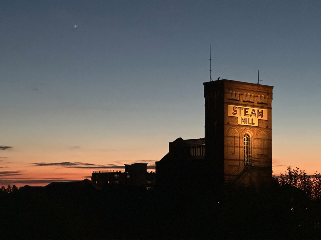 Old steam mill in Chester at sunset/twillight with Venus in the sky to the left.