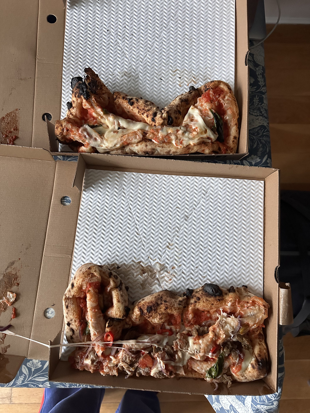 Ruined squashed pizza in a box
