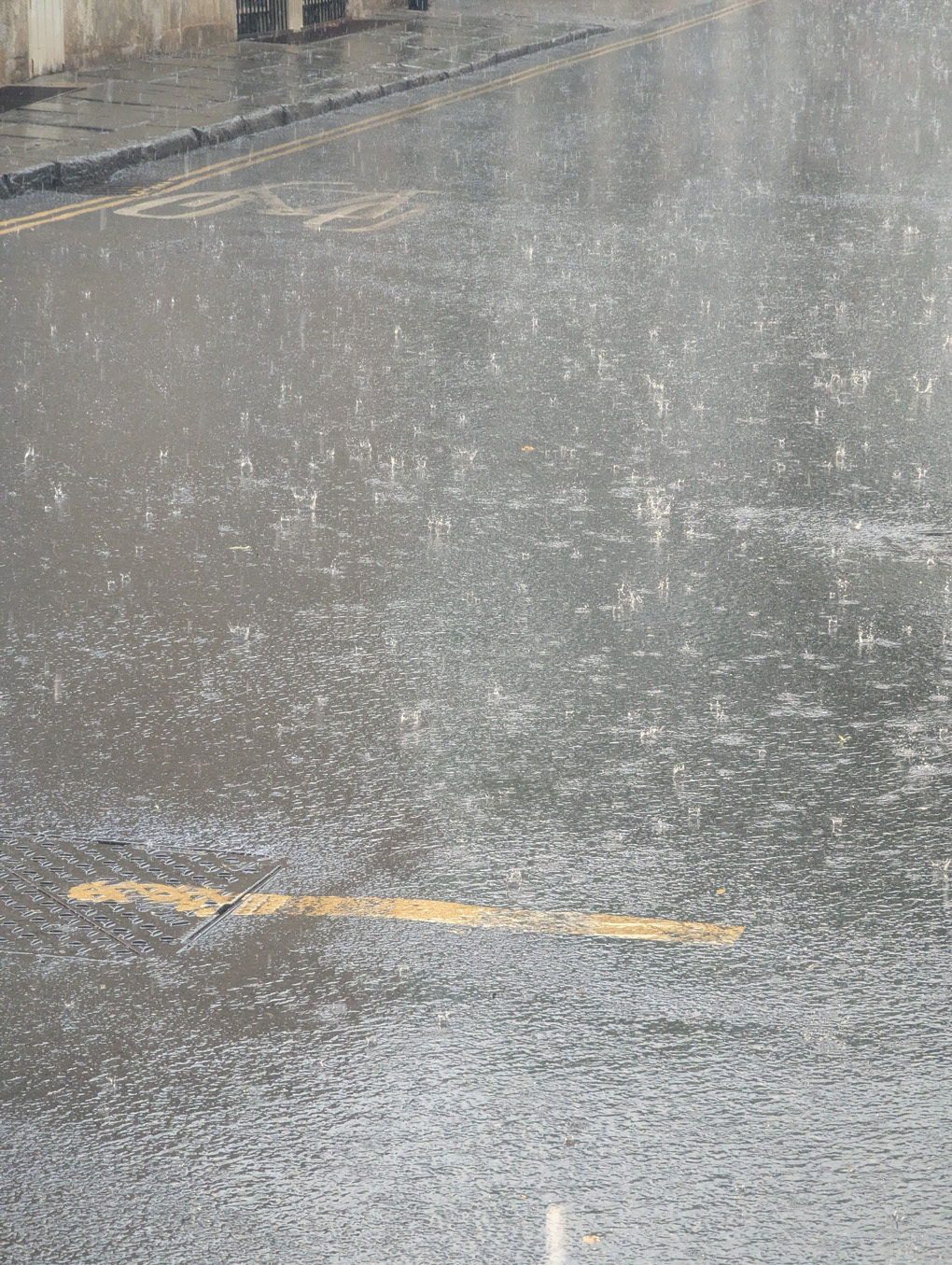 Rain hammering down on the road