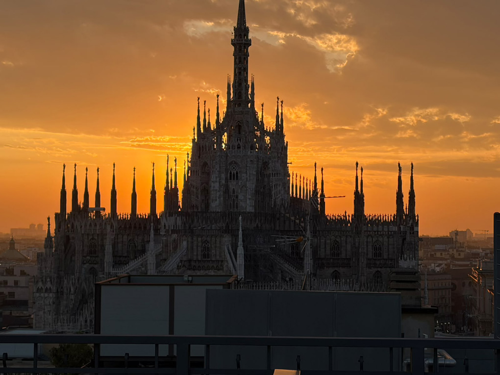 The Duomo of Milan against a fiery sunset