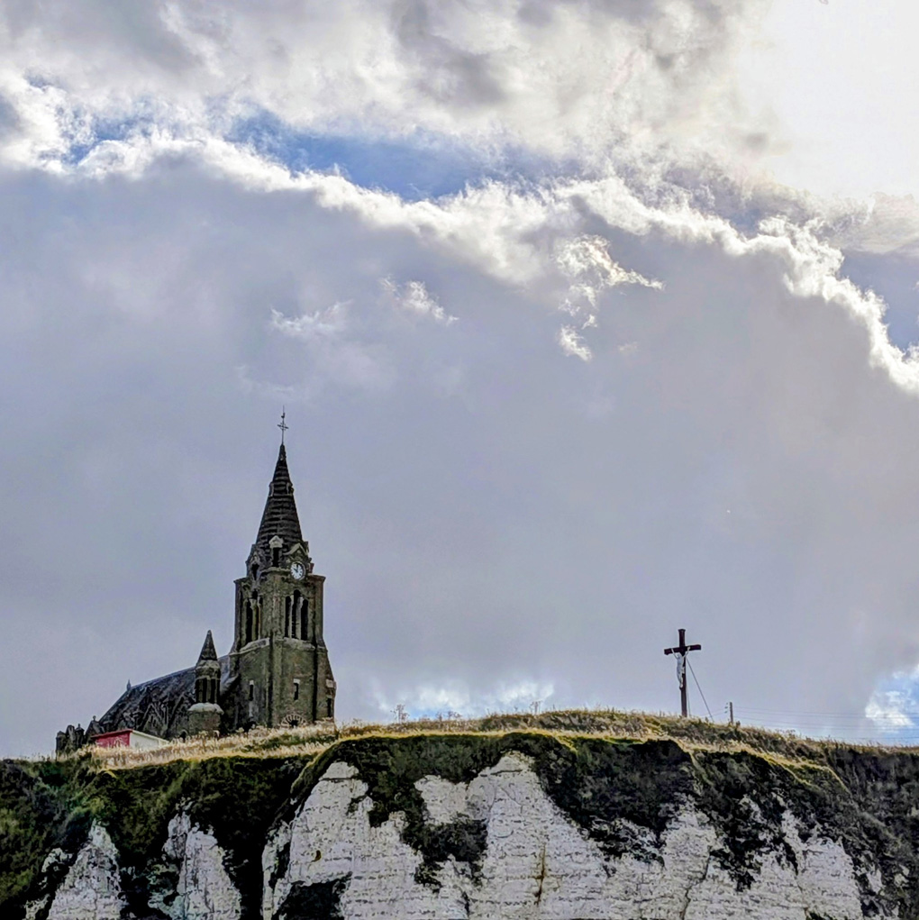 Church and a cross on a hill