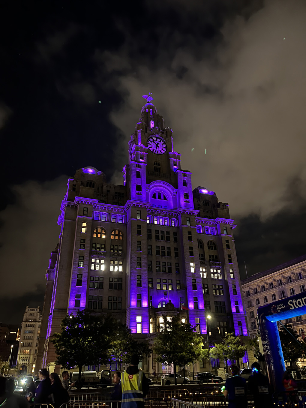 A building lit up in purple lights