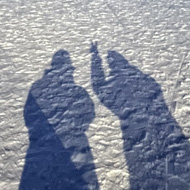 Wintery evening scene with two shadows.