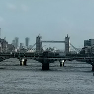 View along the Thames from London Blackfriars station, with Docklands and Tower Bridge in the distance.