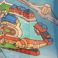 I spied a mural of a helicopter with a difference - depicting many cool structures within it of glass walkways, parcs, woods, and many cool buildings. Under the helicopter is suspended a lifeboat. Someone had a great imagination.