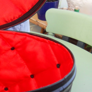 Vintage tin hat box decorated and lined with a steam punk theme.