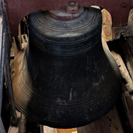 Picture of a bell in a church tower.