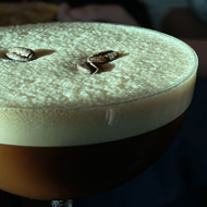 Espresso martini lit up by sunlight.