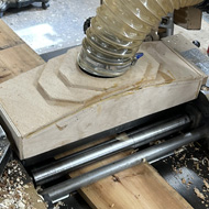 Equipment to test the thickness of an old floorboard.