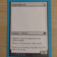 A print card about the size of a playing card sits in a car sleeve