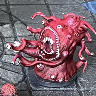 A tabletop RPG dungeon scene featuring painted miniatures on a gridded stone-tile game board enclosed by rocky walls. The setup includes a central stone archway with a robed figure, several purple tentacled creature miniatures, a red multi-eyed monster, a corrupted warrior figure, a swirling well, decorative stone pillars, and scatter terrain including wooden crates and barrels. The board features a circular pattern of coloured tiles in red, blue, green, and yellow.