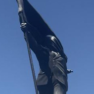 New London statue of man blinded by flag