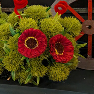 A Large, Green Catapiller, made from fresh flowers.