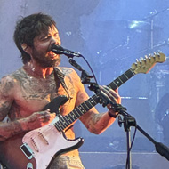 Lead singer of the band Biffy Clyro performing on stage
