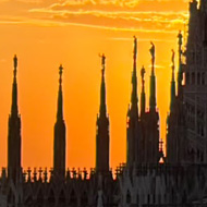The Duomo of Milan against a fiery sunset