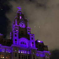 A building lit up in purple lights